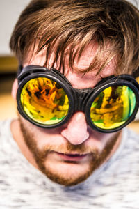 Close-up portrait of a young man with reflection