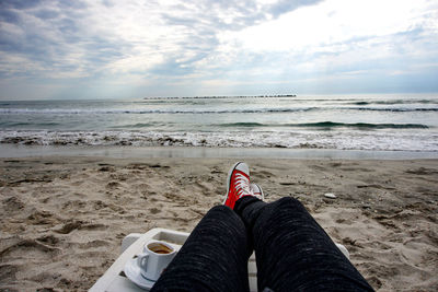 Scenic view of sea against cloudy sky