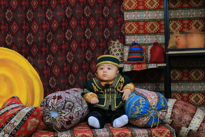 Cute boy sitting at home