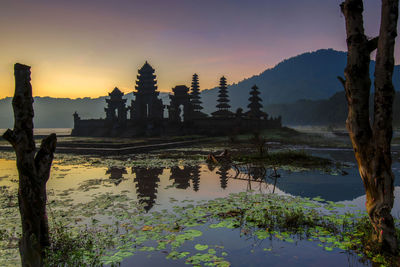 Scenic view of lake against sky during sunset