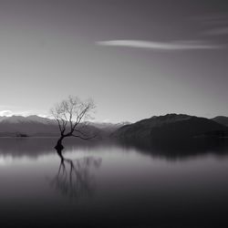 Scenic view of lake with mountains in background