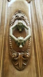 Close-up of buddha statue on door