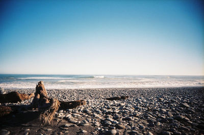 Scenic view of sea against clear blue sky