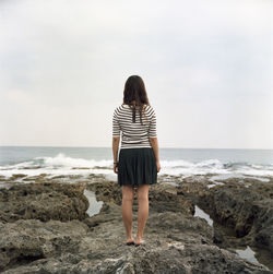 Rear view of woman on beach