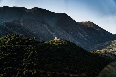 Low angle view of mountain range against sky