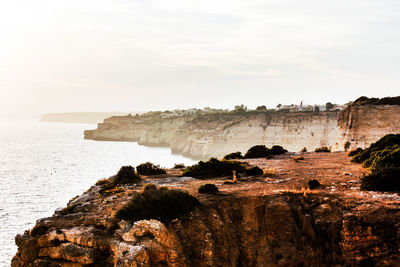 Scenic view of cliff against sky