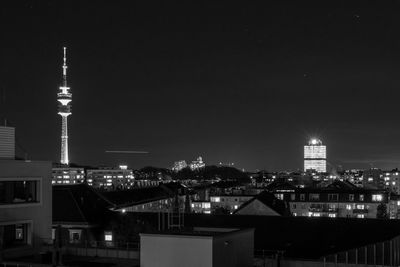 Illuminated buildings in city at night