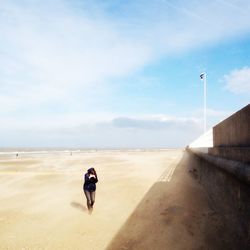 Woman standing on beach