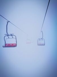 Overhead cable car against sky during winter