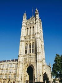 Low angle view of historical building against blue sky