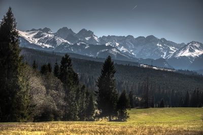 Scenic view of snowcapped mountains against sky