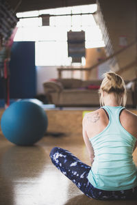 Rear view of woman doing yoga