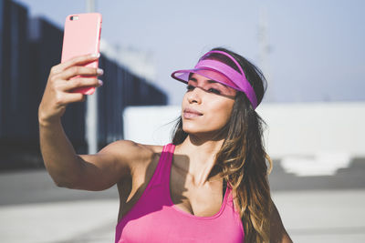 Young woman using mobile phone