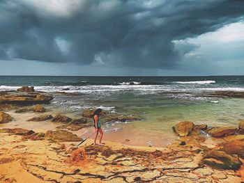 Scenic view of sea against cloudy sky