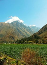 Scenic view of mountains against cloudy sky