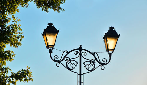 Low angle view of lamp post against sky