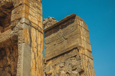 Low angle view of old building against clear sky