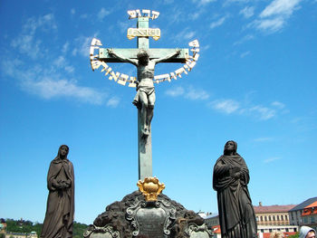 Low angle view of statue against sky