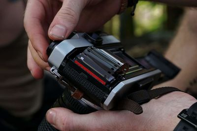 Close-up of hand holding camera