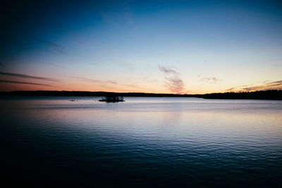 Scenic view of sea against sky at sunset