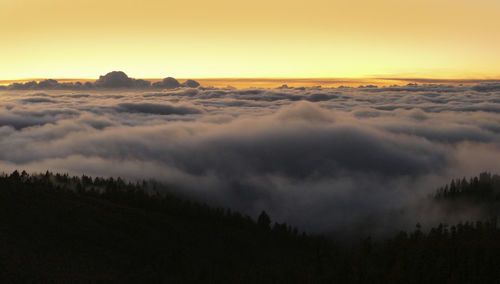 Scenic view of mountains against sky during sunset