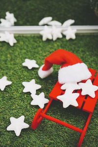 Close-up of christmas decorations on field