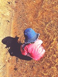 High angle view of girl climbing on land