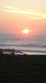 Scenic view of sea against sky during sunset