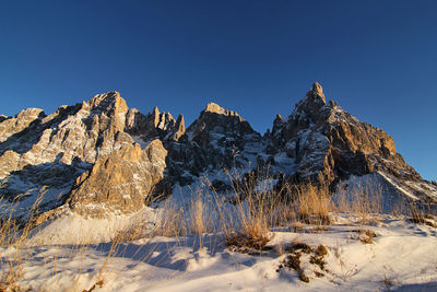 Italy, dolomities unesco heritage. scenic view of snowcapped  montains against clear sky. 