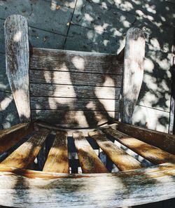 High angle view of wooden bench