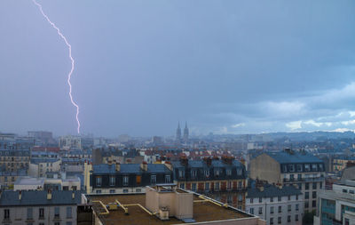 Cityscape with lightning at sky