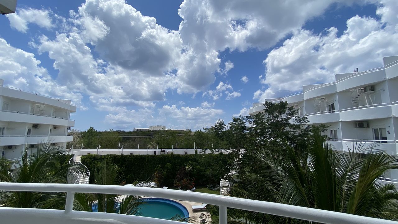 SWIMMING POOL BY BUILDING AGAINST SKY