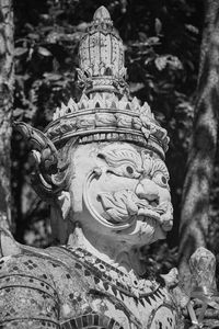 Close-up of statue against trees