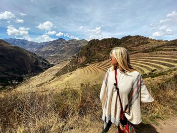 Woman standing against mountains