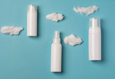 Set of cosmetic products on a blue background with clouds. health and medicine concept