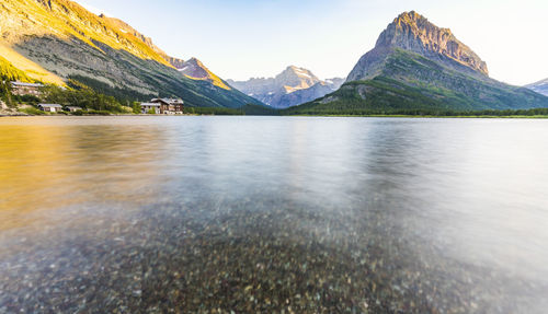 Scenic view of lake and mountains against sky