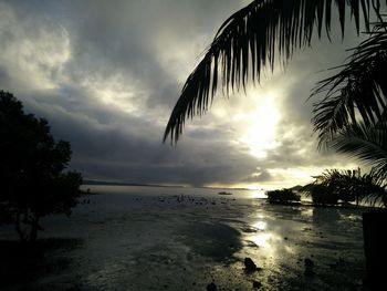 Scenic view of sea against sky at sunset