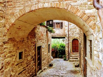 Empty alley amidst buildings