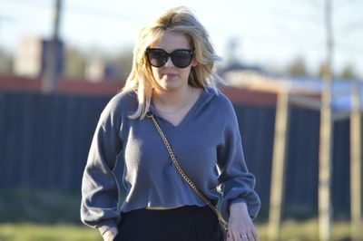 Young woman wearing sunglasses standing outdoors