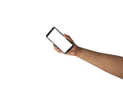 Hand holding smart phone against white background