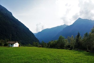 Scenic view of landscape and mountains against sky