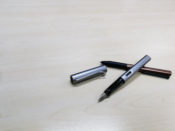 High angle view of pen on table