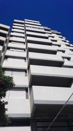 Low angle view of modern building against clear sky