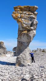 Low angle view of rock formation on cliff