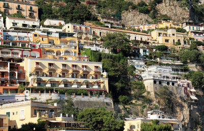 Low angle view of buildings on hill at positano