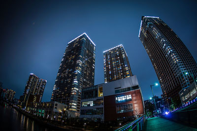 Illuminated buildings in city at night