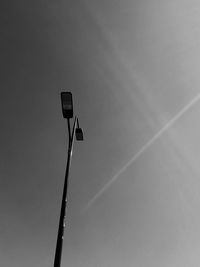 Low angle view of street light against sky