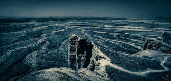 High angle view of sea shore against sky