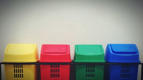 Close-up of multi colored trash boxes