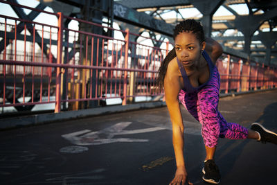 Portrait of young woman standing in gym